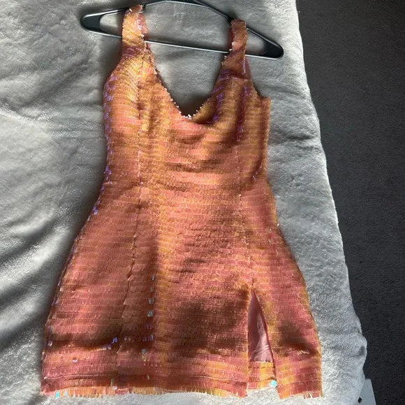 This dress is from SorelleUK! It is a size xs and in the color Peachy. - Picture 3 of 4